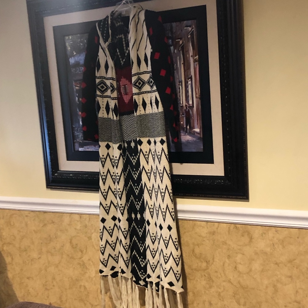 Long throw sweater/coat, hood, fringed ends.